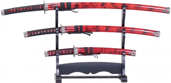 Katana, Wakizashi and Tanto on a sword display stand